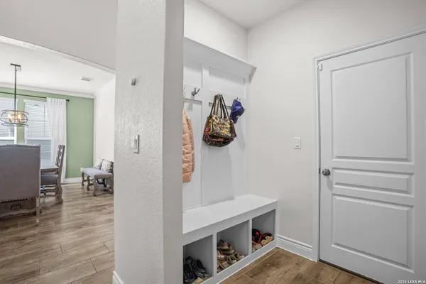 a view of hallway with livingroom and furniture