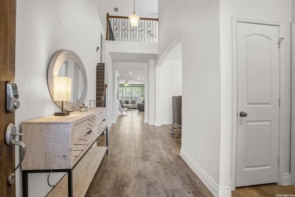 a view of living room with granite countertop furniture and wooden floor