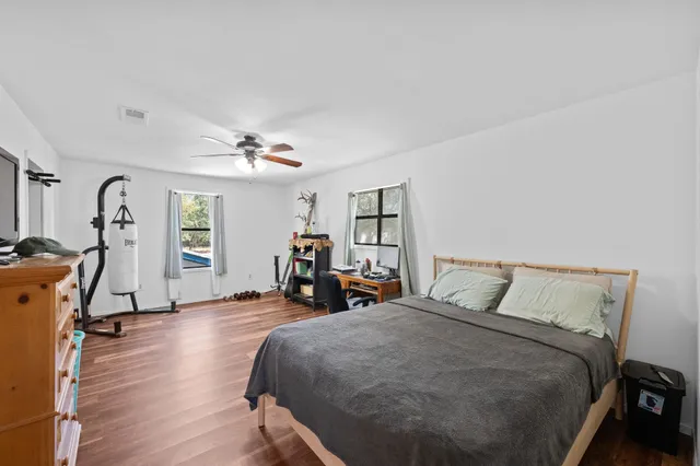 a bed room with a bed and a table