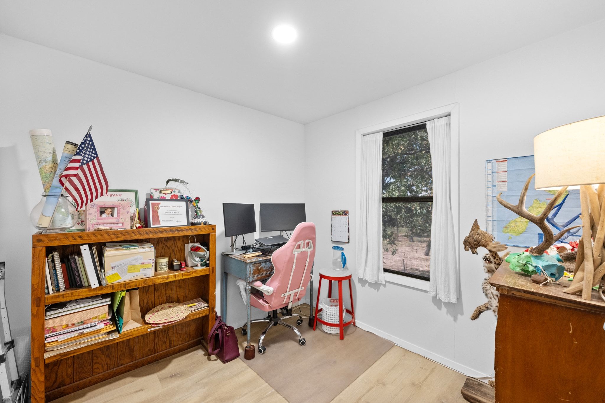 376 Jones Road Cedar Creek, TX 78612 - Photo 17 of 40 a bedroom with furniture and a book shelf