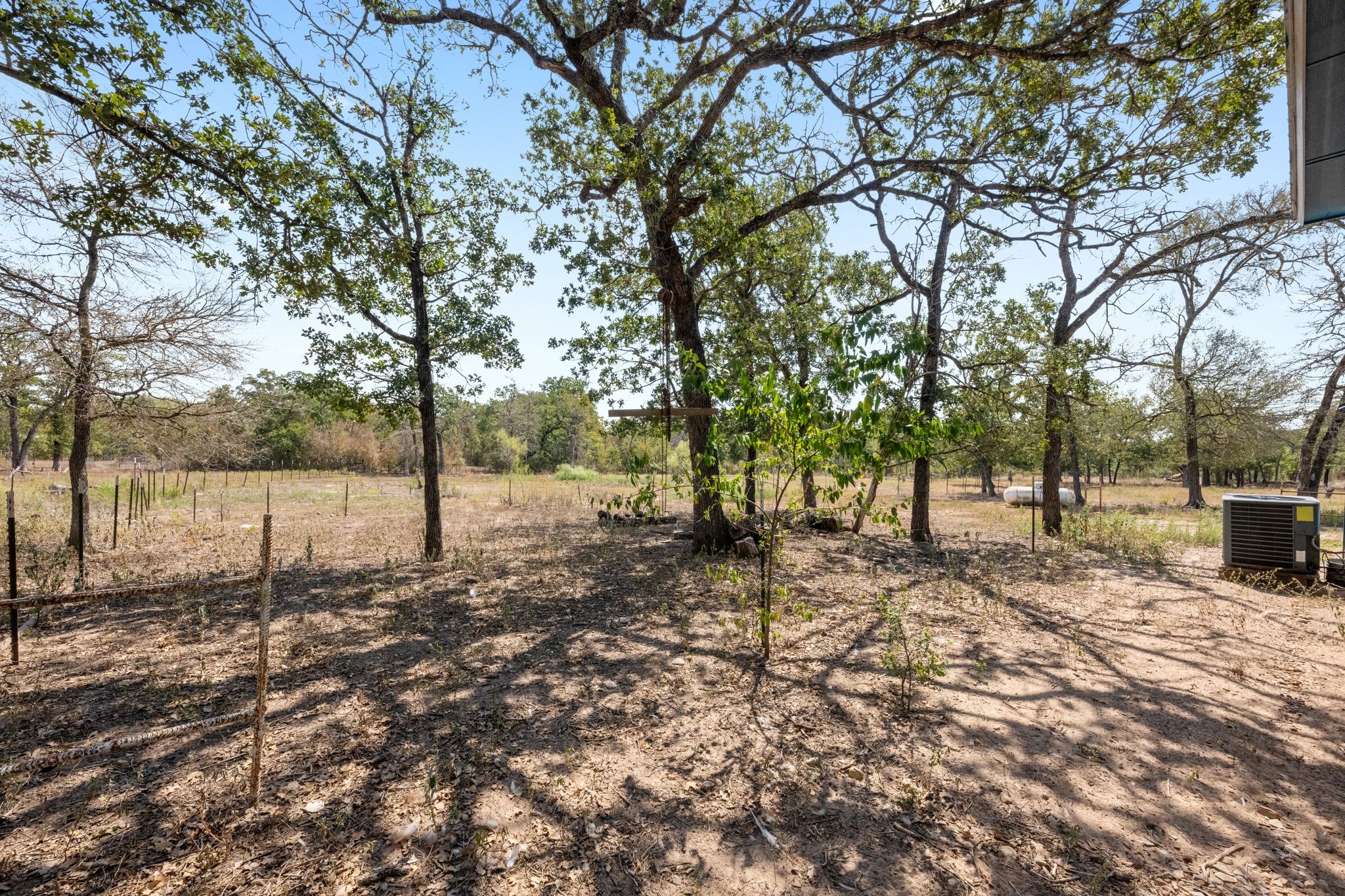 376 Jones Road Cedar Creek, TX 78612 - Photo 26 of 40 a backyard of a house with lots of green space