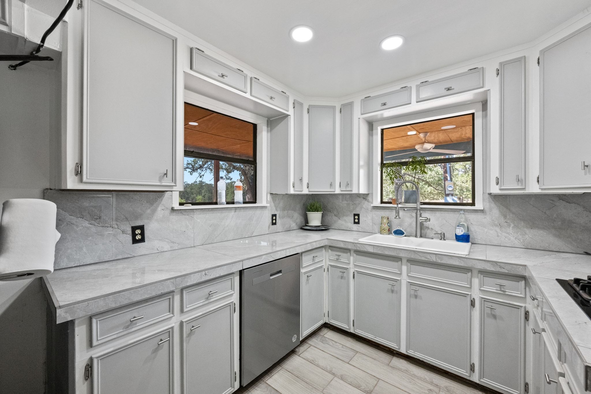 376 Jones Road Cedar Creek, TX 78612 - Photo 7 of 40 a kitchen with a sink window and cabinets