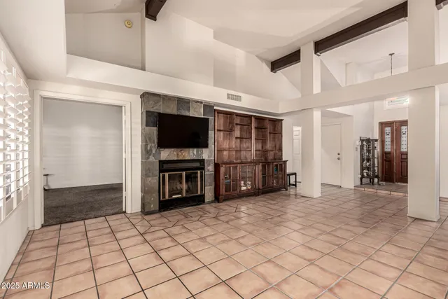 a view of an empty room with a flat screen tv