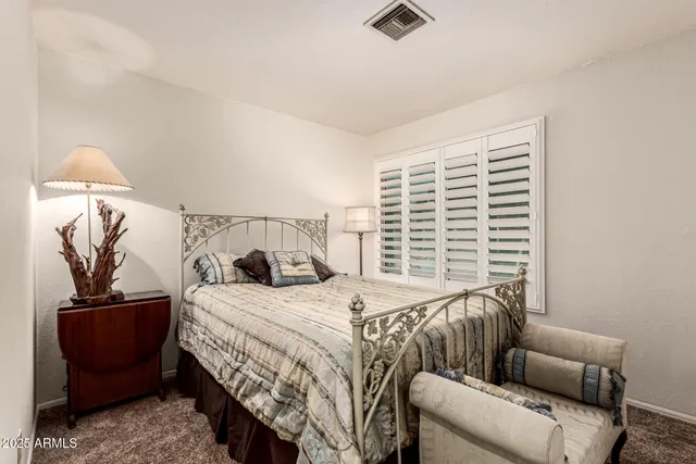 a bedroom with furniture and a window