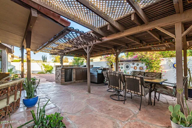 a view of a chairs and table in the patio