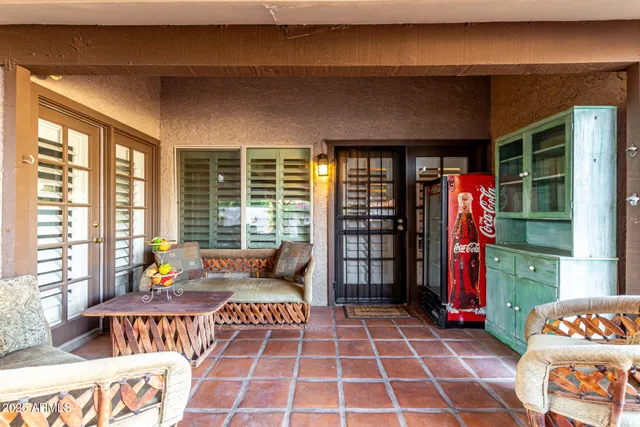 a theatre with furniture and floor to ceiling window