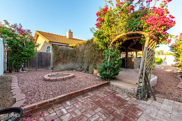 a backyard of a house with lots of green space and trees