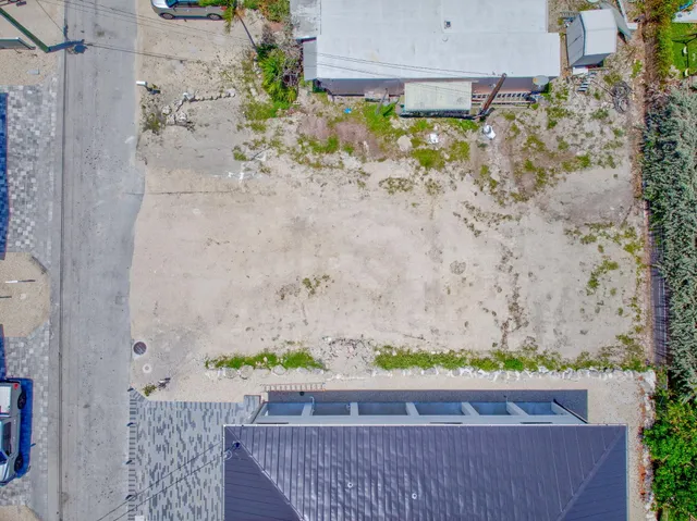 a wooden floor with glass top table and chair