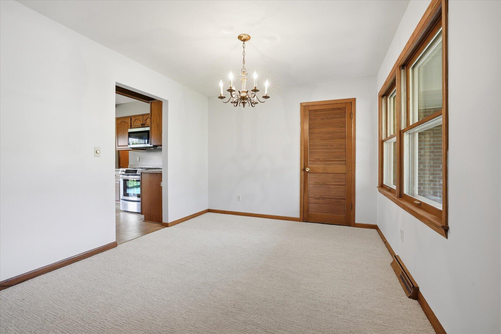 14235 West Maylore Drive New Berlin, WI 53151 - Photo 8 of 40 Dining Room w/Walk-In Pantry, NEW Carpet, & Fresh Paint