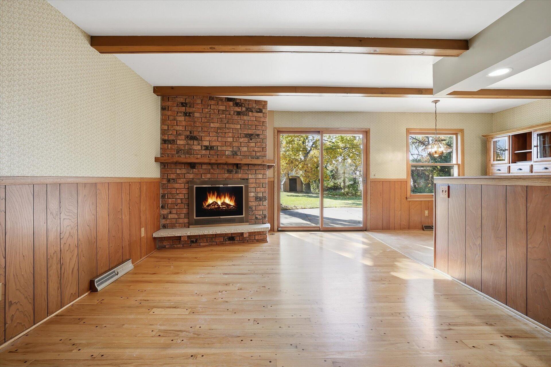 14235 West Maylore Drive New Berlin, WI 53151 - Photo 15 of 40 Family Room w/Natural Fireplace, Wood Floors, & Beam Ceiling