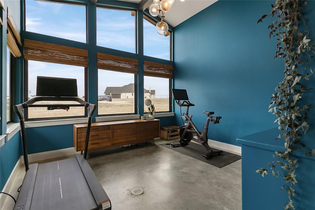 12964 Torello Court Godley, TX 76044 - Photo 26 of 40 a room with furniture and flat screen tv