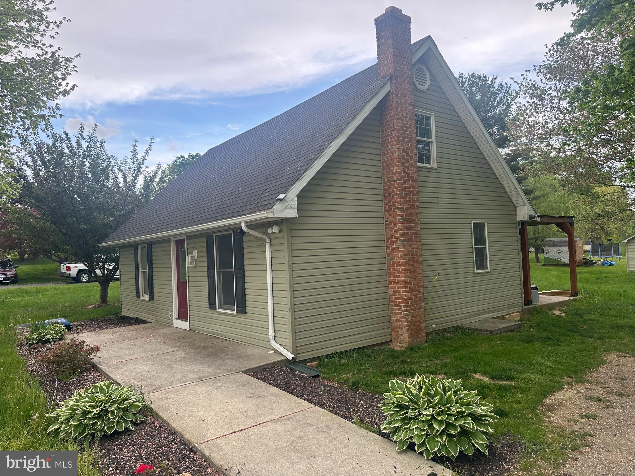 933 Buck Road Quarryville, PA 17566 - Photo 1 of 8 a view of a house with a yard
