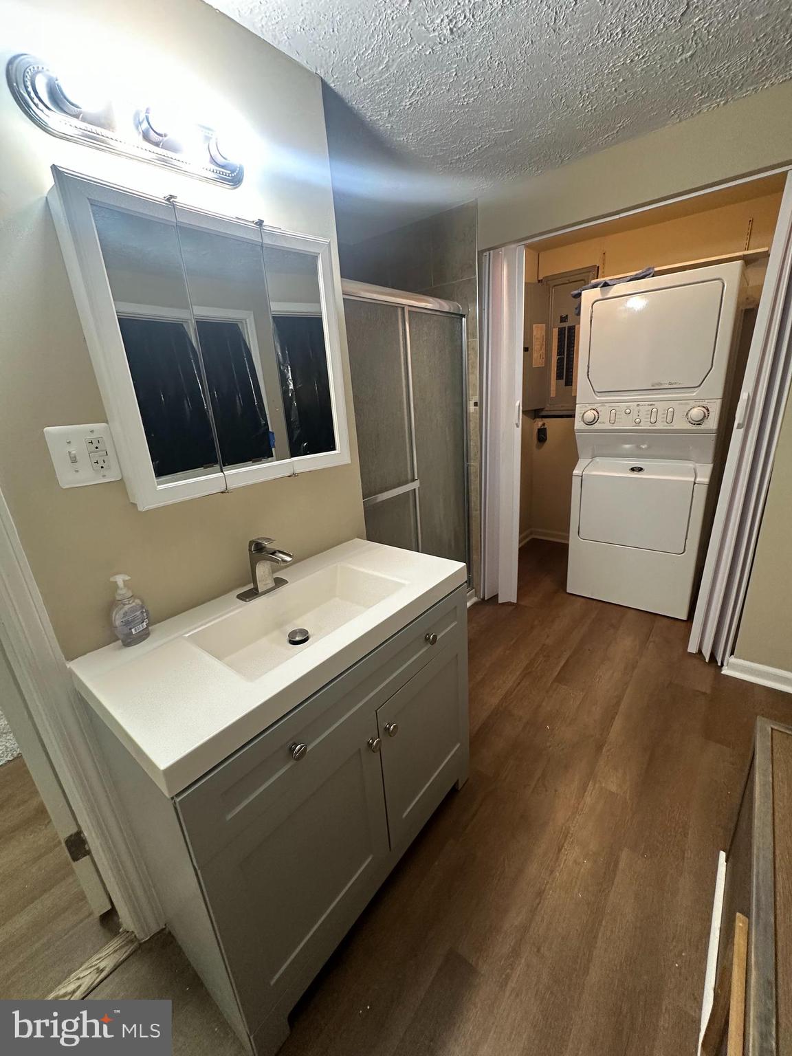 933 Buck Road Quarryville, PA 17566 - Photo 4 of 8 a bathroom with a double vanity sink and mirror