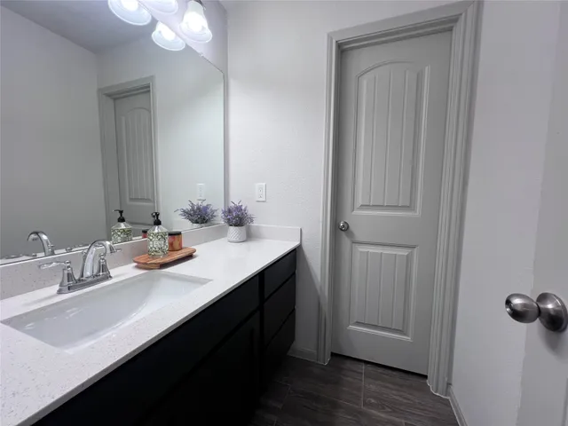 a bathroom with a toilet and bathtub