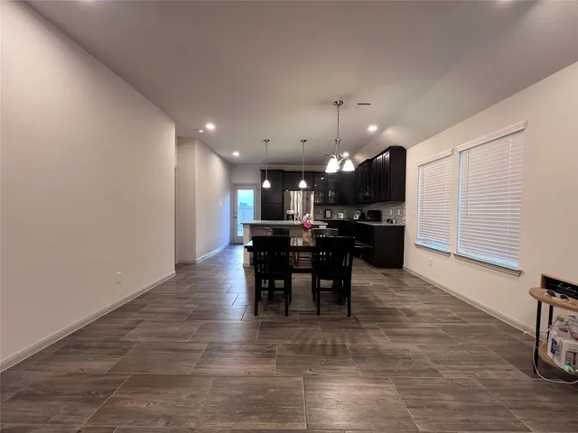 a view of a kitchen and dining room