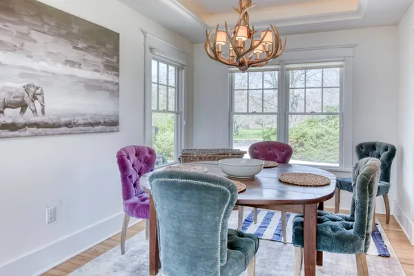 a view of a dining room with furniture window and outside view