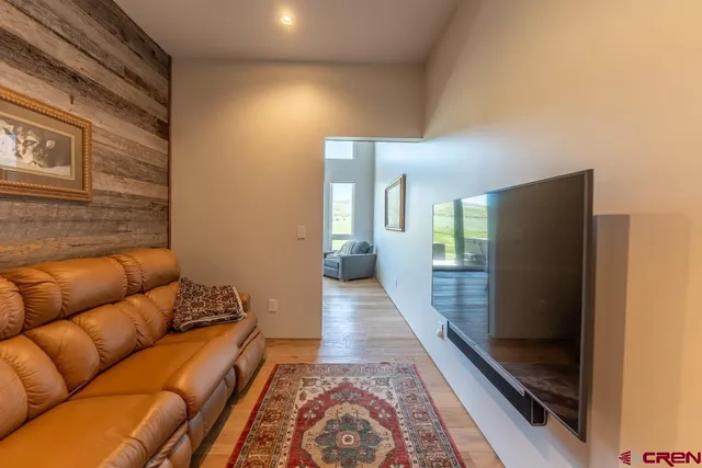 a living room with furniture and a rug