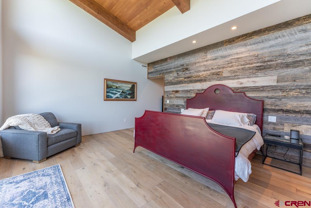 347 Overlook Trail Gunnison, CO 81230 - Photo 13 of 45 a bed room with a bed and a couch