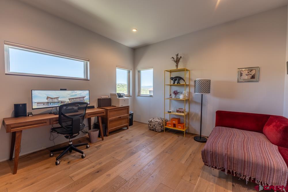 347 Overlook Trail Gunnison, CO 81230 - Photo 17 of 45 a bedroom with furniture and a wooden floor