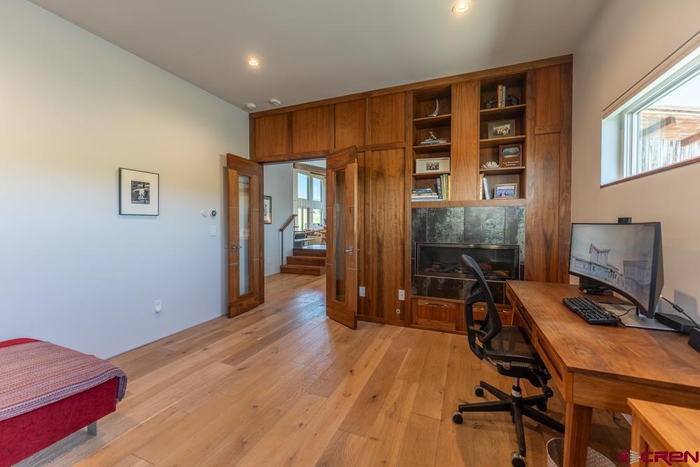 347 Overlook Trail Gunnison, CO 81230 - Photo 18 of 45 a view of a room with wooden floor and furniture