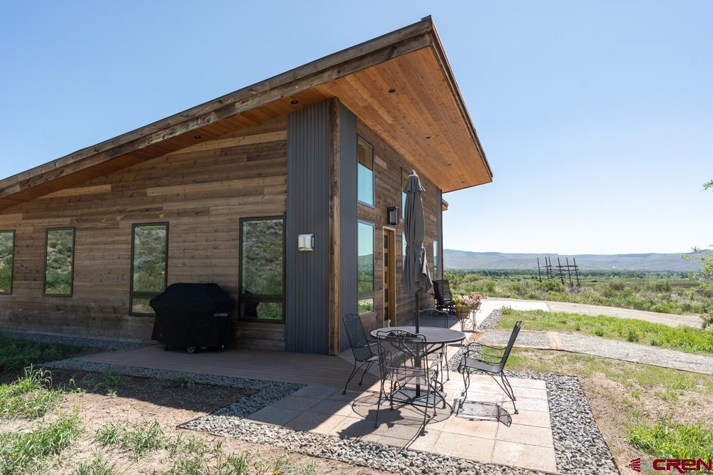 347 Overlook Trail Gunnison, CO 81230 - Photo 25 of 45 a view of a chair and tables in the patio