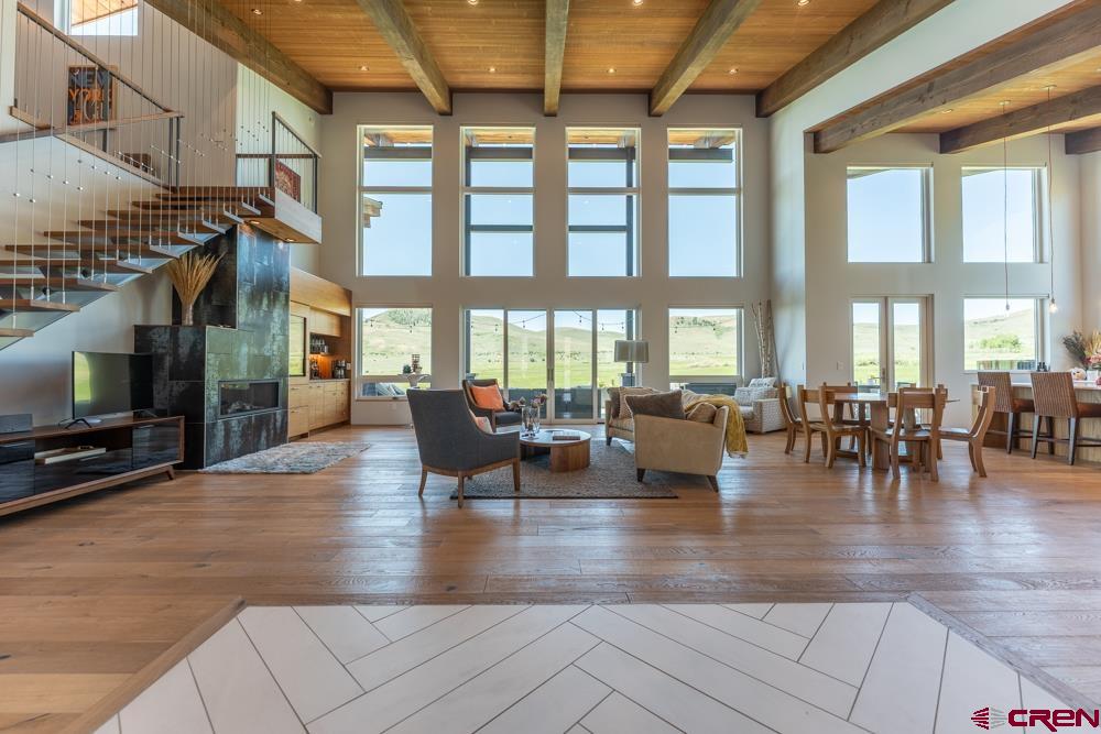 347 Overlook Trail Gunnison, CO 81230 - Photo 3 of 45 an outdoor living space with furniture and a flat screen tv