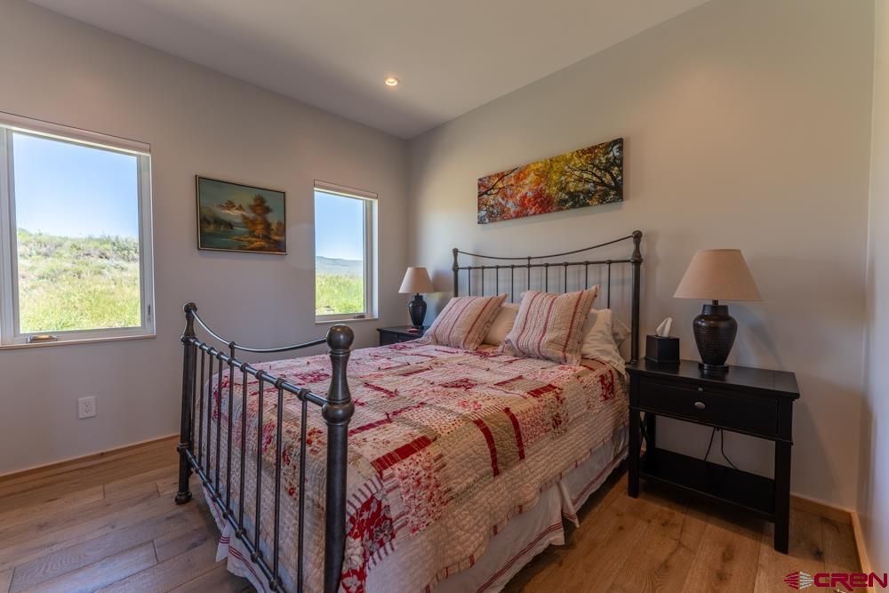 347 Overlook Trail Gunnison, CO 81230 - Photo 31 of 45 a bedroom with a bed and a window