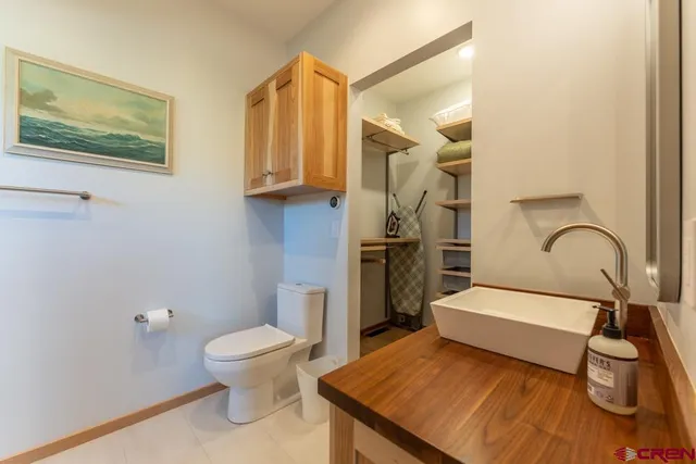 a bedroom with a bed and a lamp