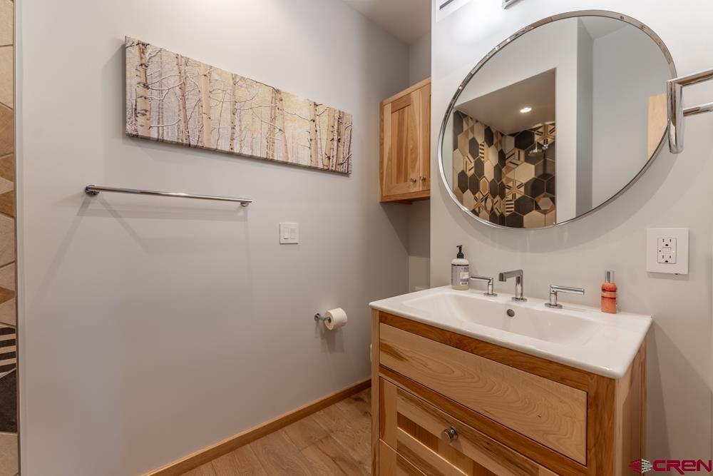 347 Overlook Trail Gunnison, CO 81230 - Photo 34 of 45 a bathroom with a sink and a mirror