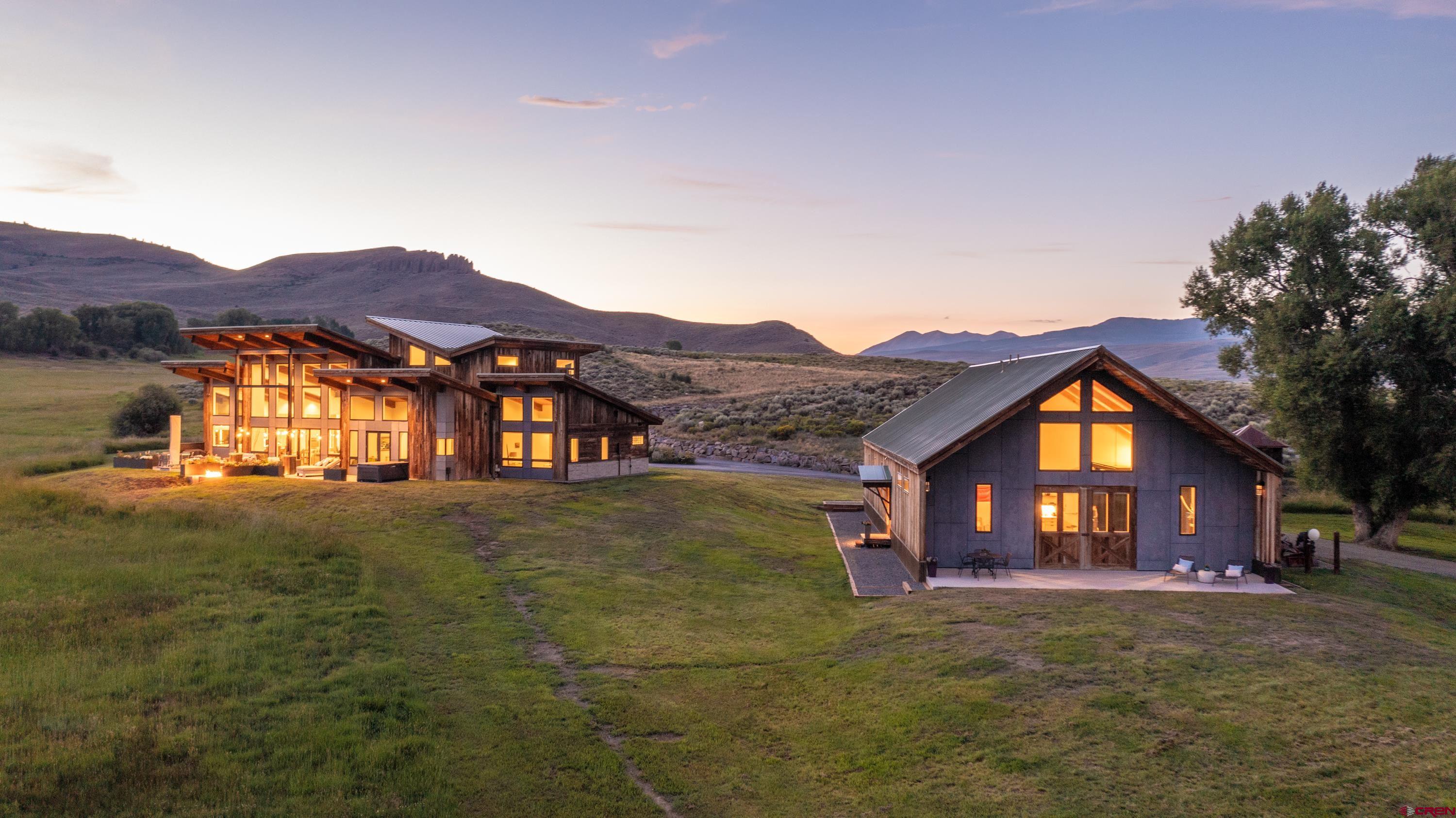 347 Overlook Trail Gunnison, CO 81230 - Photo 43 of 45 a view of a big house with a big yard and large trees