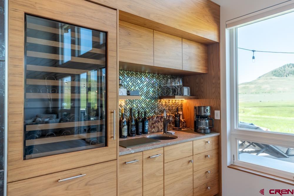 347 Overlook Trail Gunnison, CO 81230 - Photo 9 of 45 a room with wooden floor and large windows