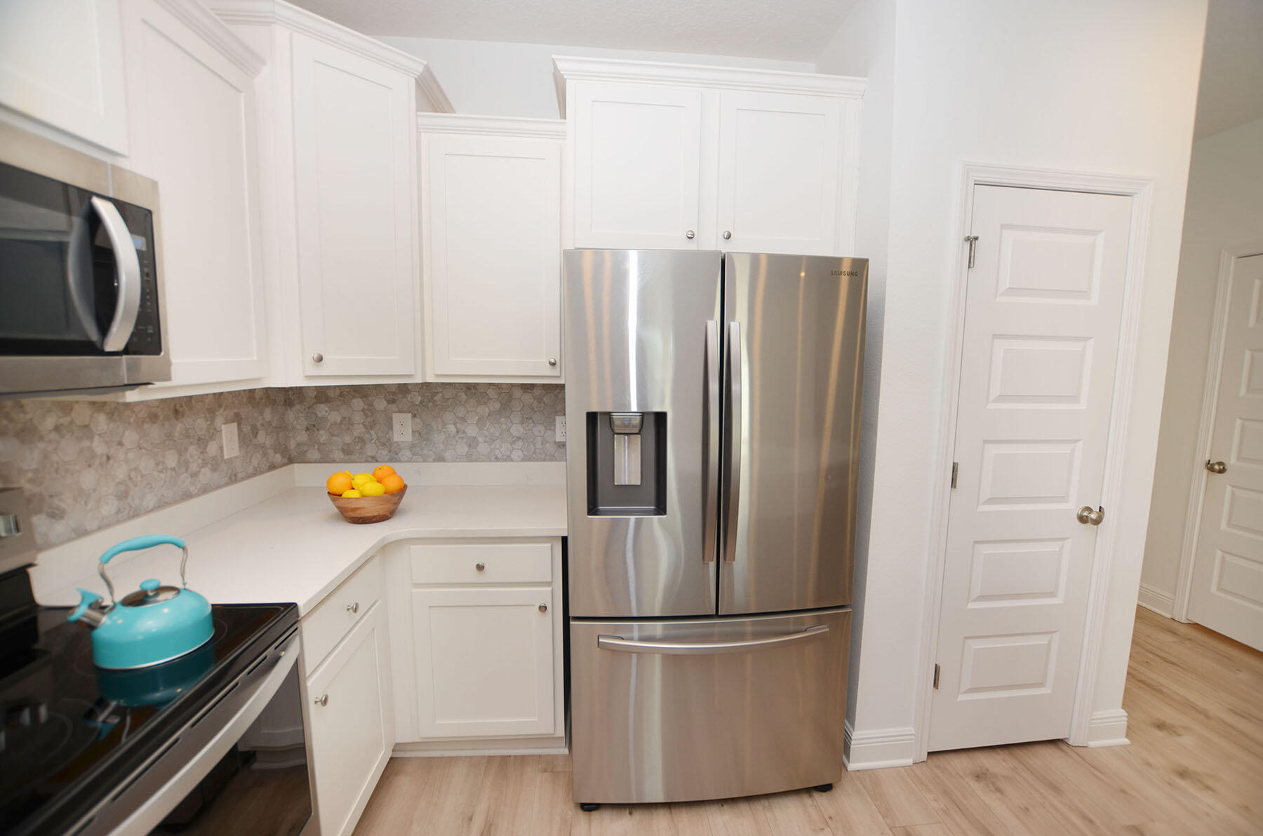 16 Redbird Loop Destin, FL 32541 - Photo 12 of 56 a kitchen with refrigerator and cabinets