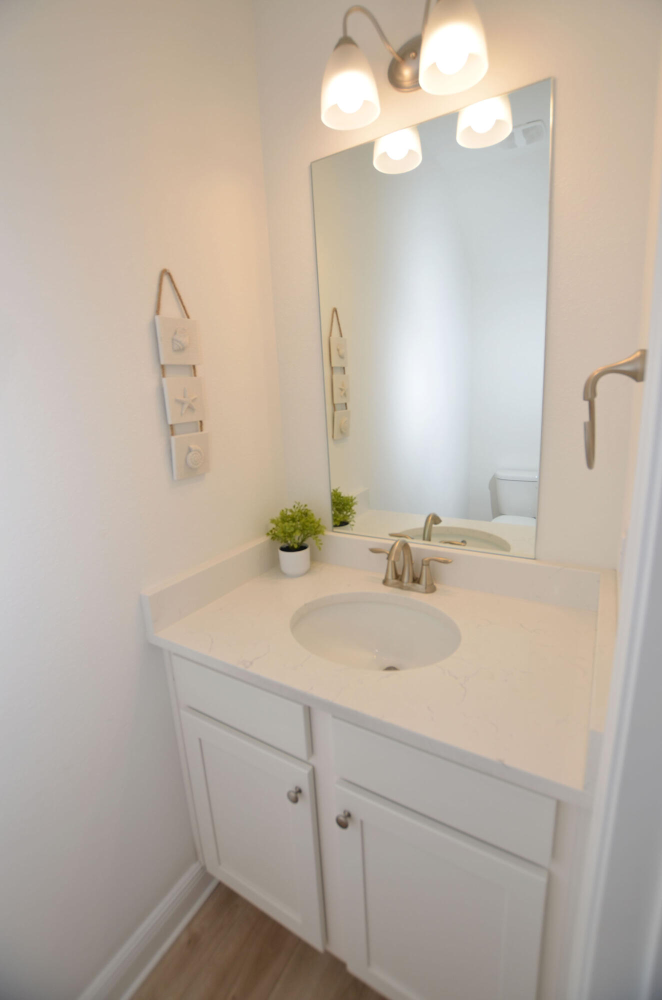 16 Redbird Loop Destin, FL 32541 - Photo 20 of 56 a bathroom with a sink vanity and mirror