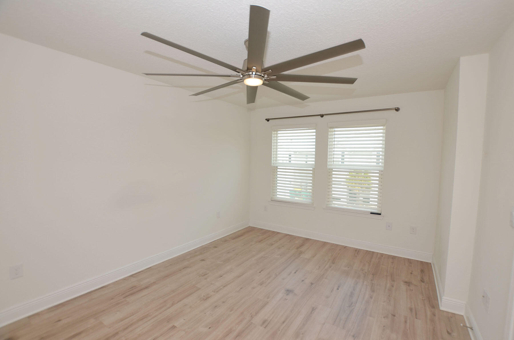 16 Redbird Loop Destin, FL 32541 - Photo 22 of 56 wooden floor in an empty room with a window