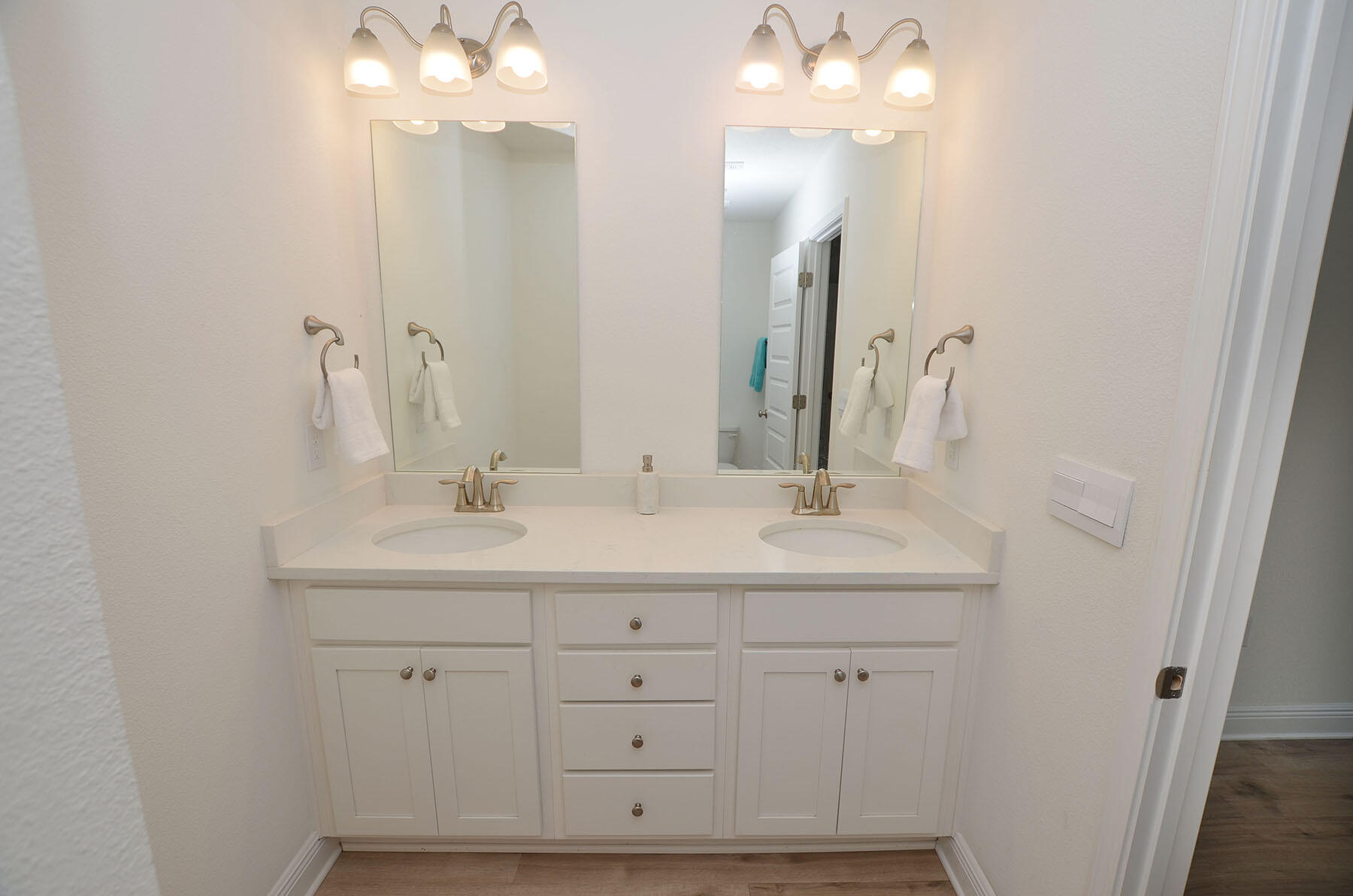16 Redbird Loop Destin, FL 32541 - Photo 26 of 56 a bathroom with a sink double vanity and a mirror