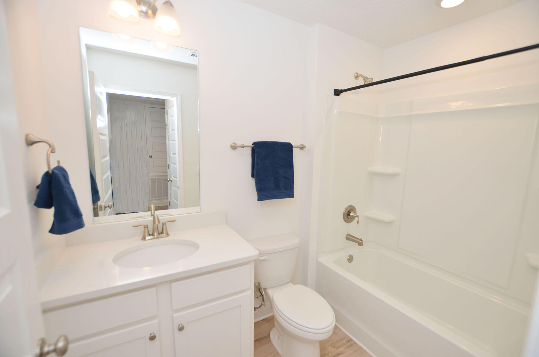 16 Redbird Loop Destin, FL 32541 - Photo 35 of 56 a bathroom with a bathtub shower sink vanity mirror and toilet