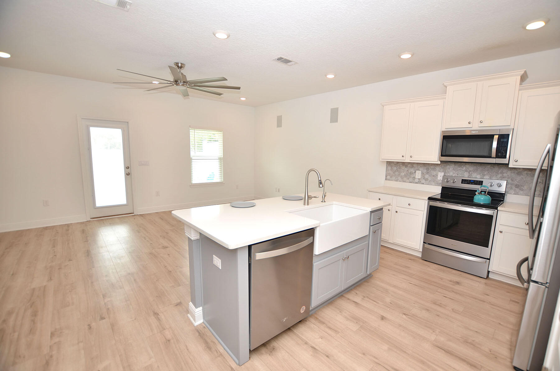 16 Redbird Loop Destin, FL 32541 - Photo 5 of 56 a kitchen with a sink stove and cabinets