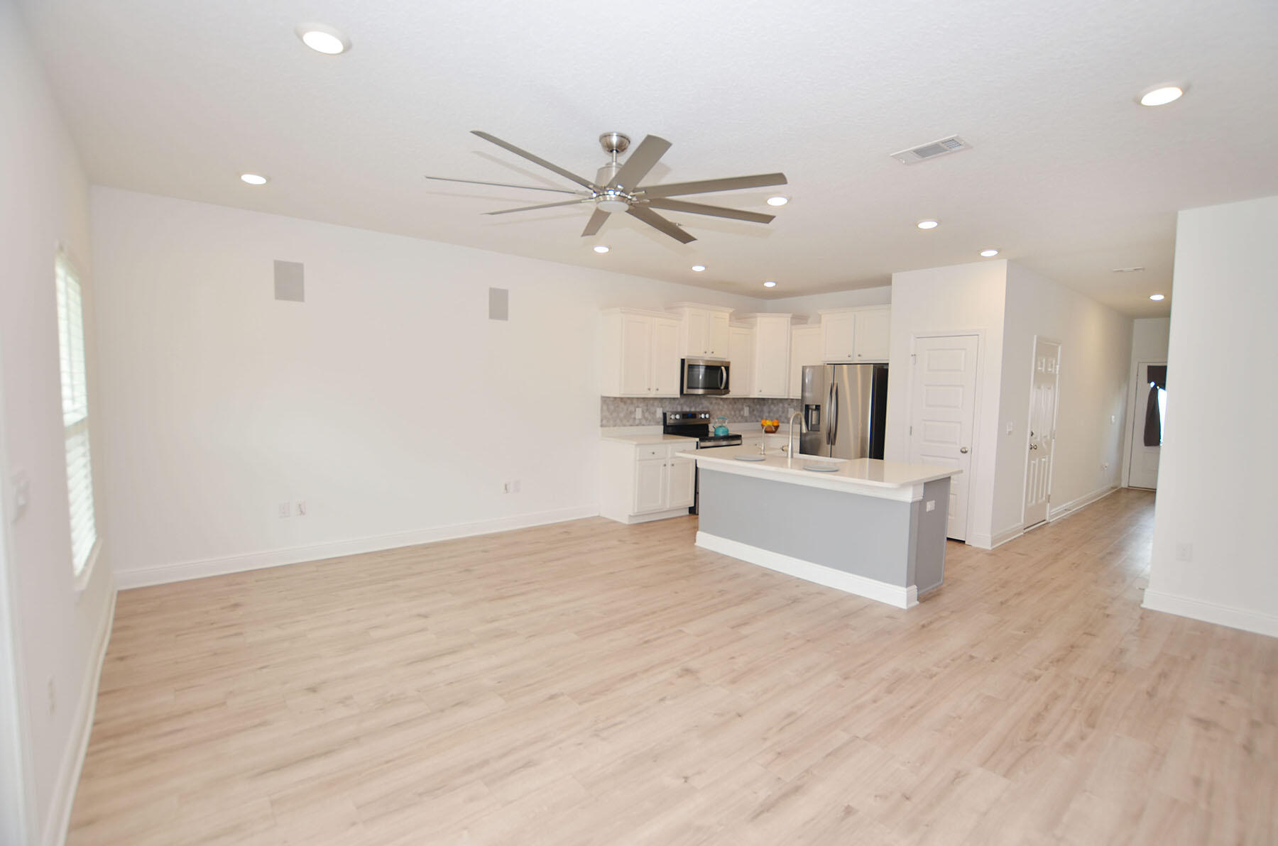 16 Redbird Loop Destin, FL 32541 - Photo 9 of 56 a view of kitchen with refrigerator microwave and stove