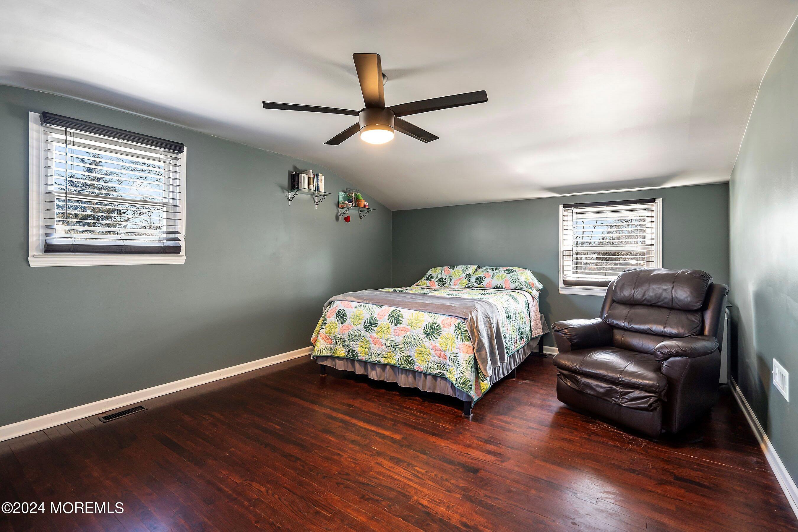 5 Hampton Road Howell, NJ 07731 - Photo 17 of 27 a bedroom with a bed and wooden floor