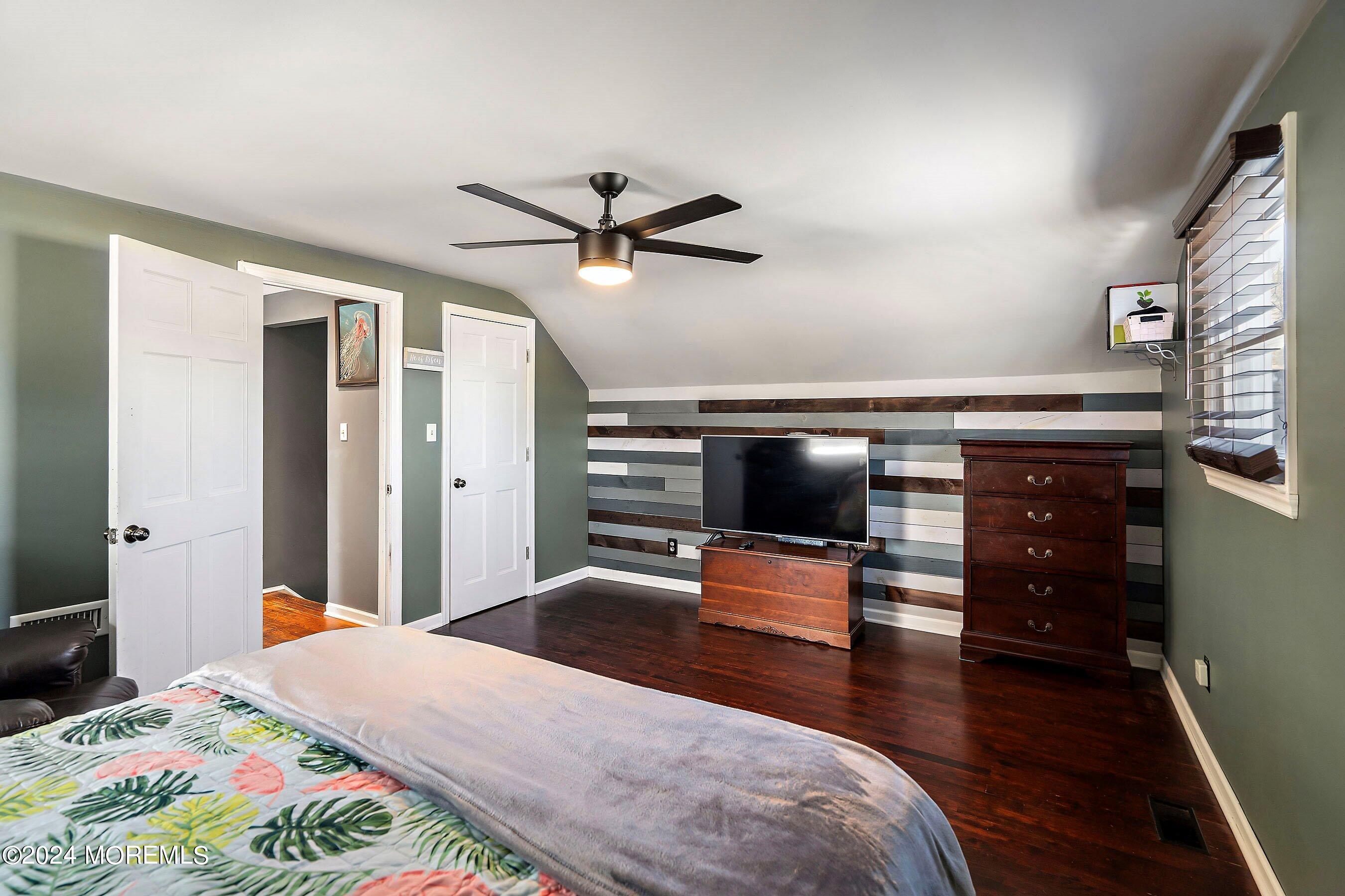 5 Hampton Road Howell, NJ 07731 - Photo 18 of 27 a bedroom with a bed and wooden floor