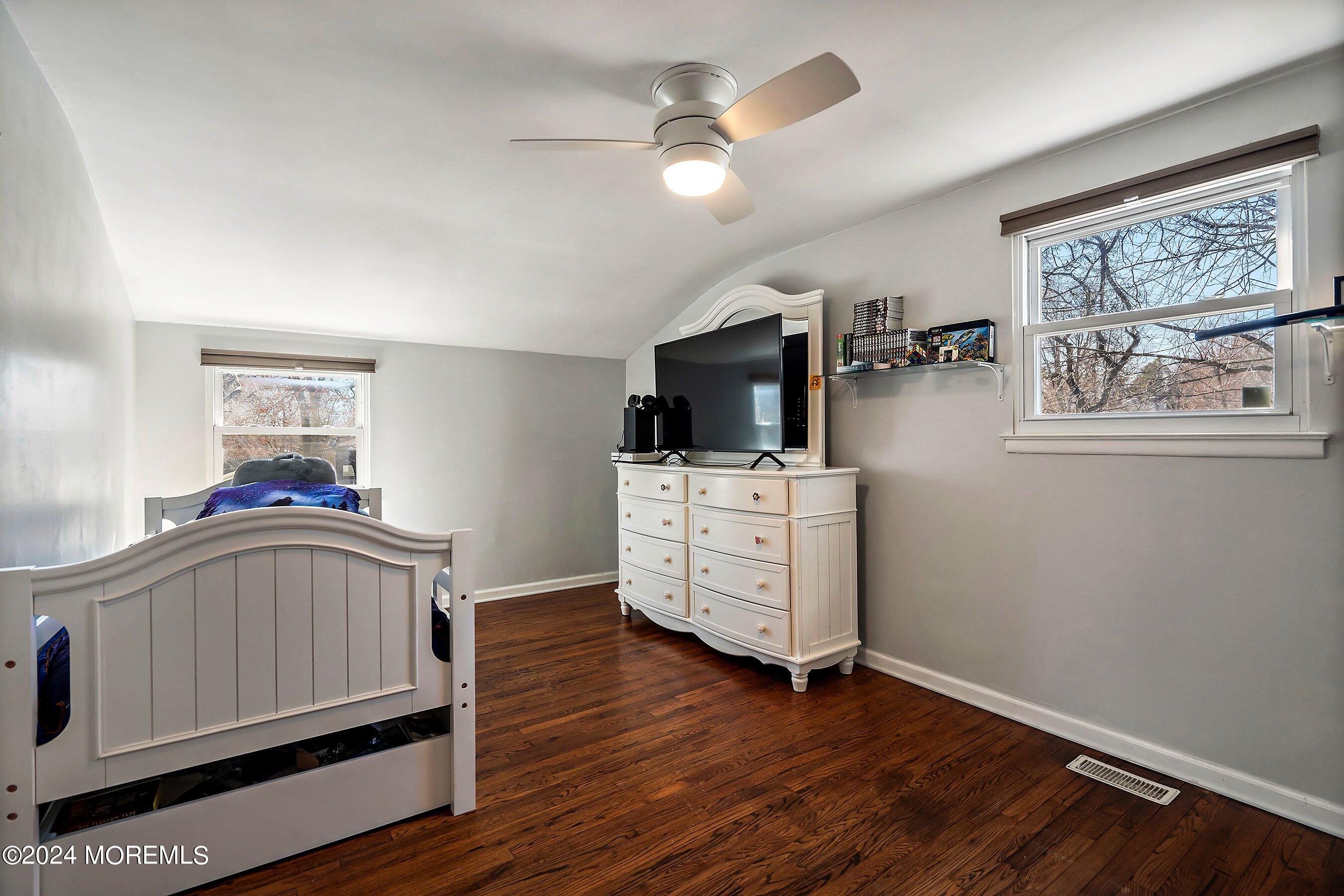 5 Hampton Road Howell, NJ 07731 - Photo 20 of 27 a living room with furniture and a flat screen tv