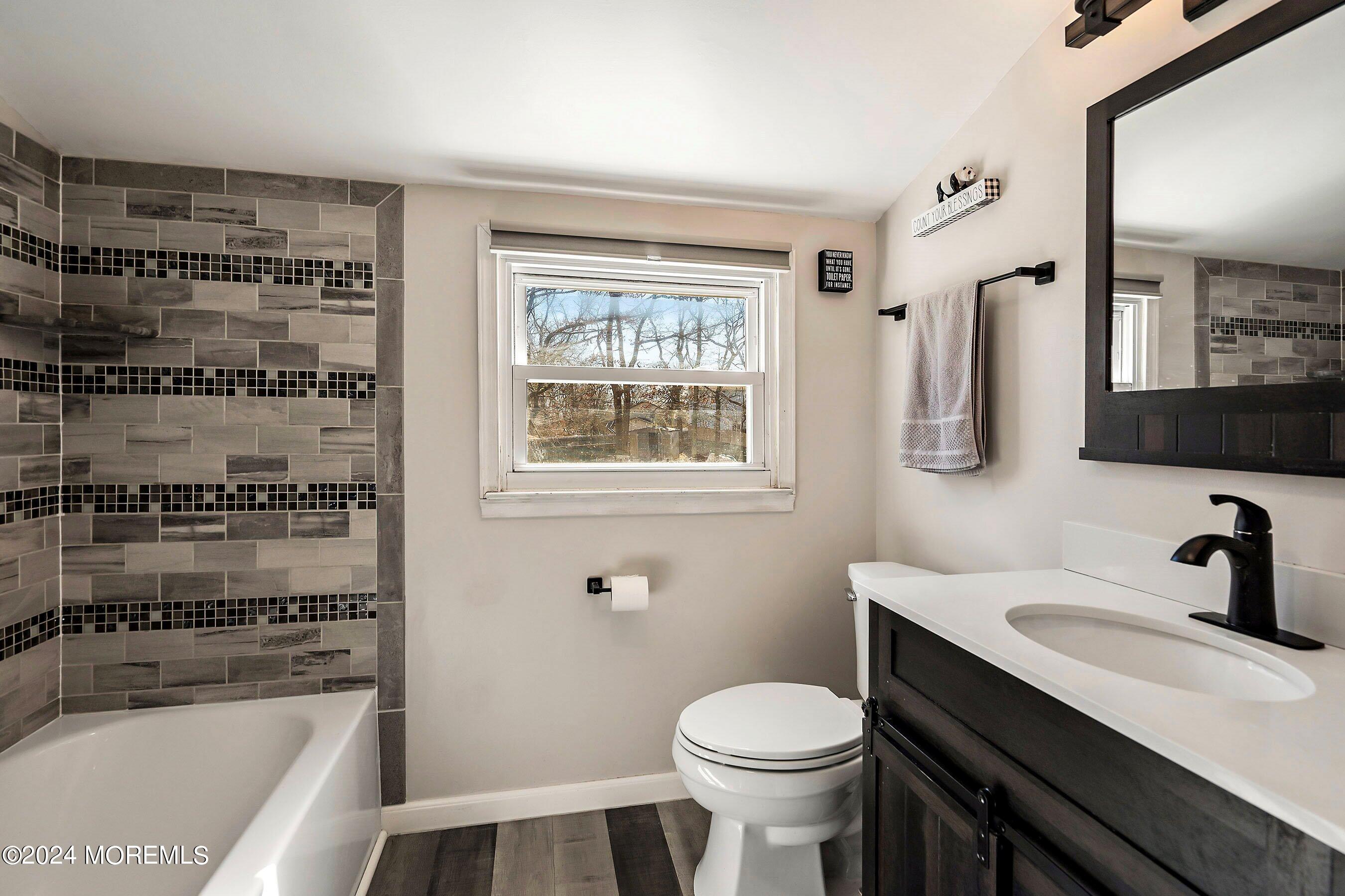 5 Hampton Road Howell, NJ 07731 - Photo 22 of 27 a bathroom with a sink a toilet and shower