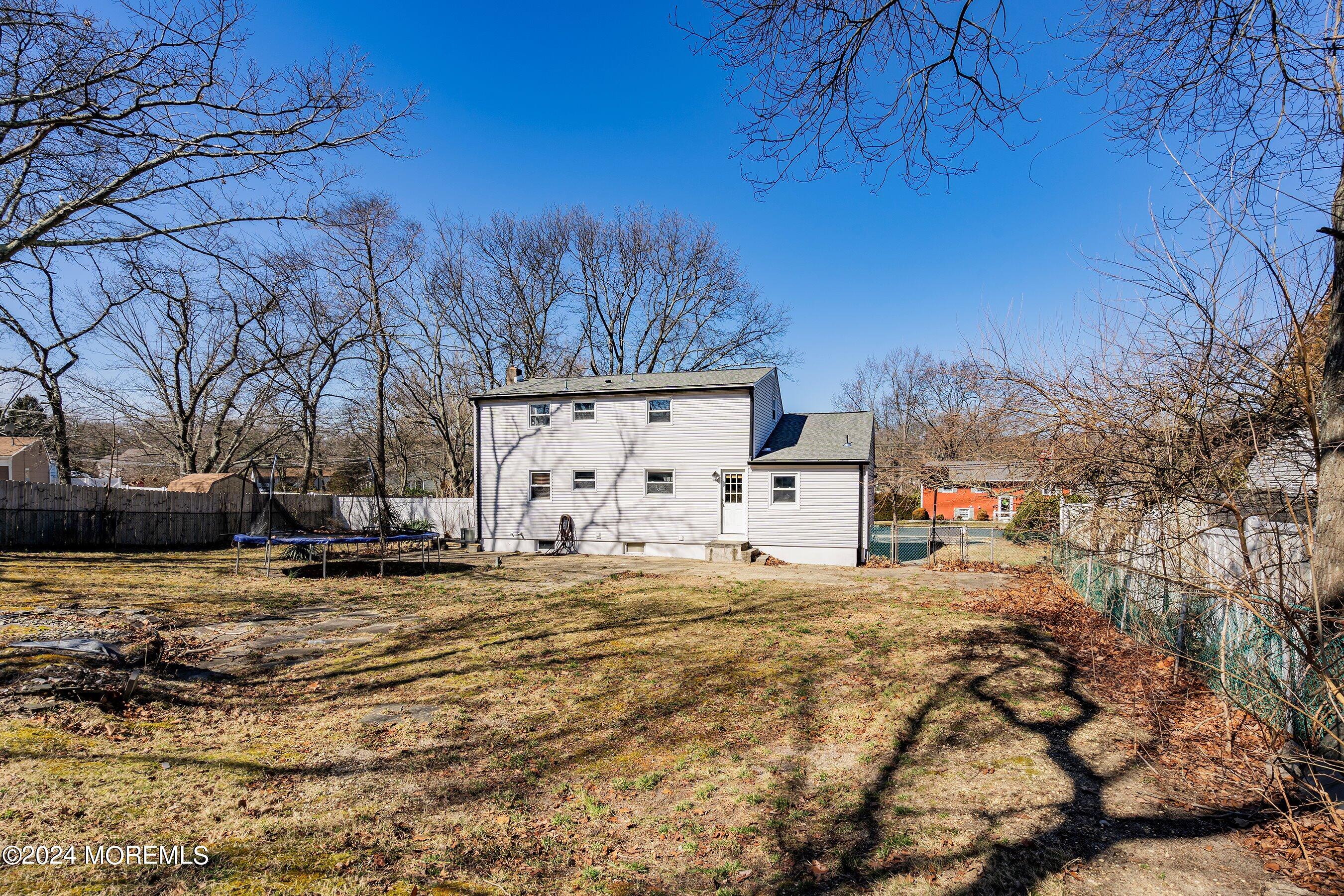 5 Hampton Road Howell, NJ 07731 - Photo 26 of 27 a view of a yard with wooden fence