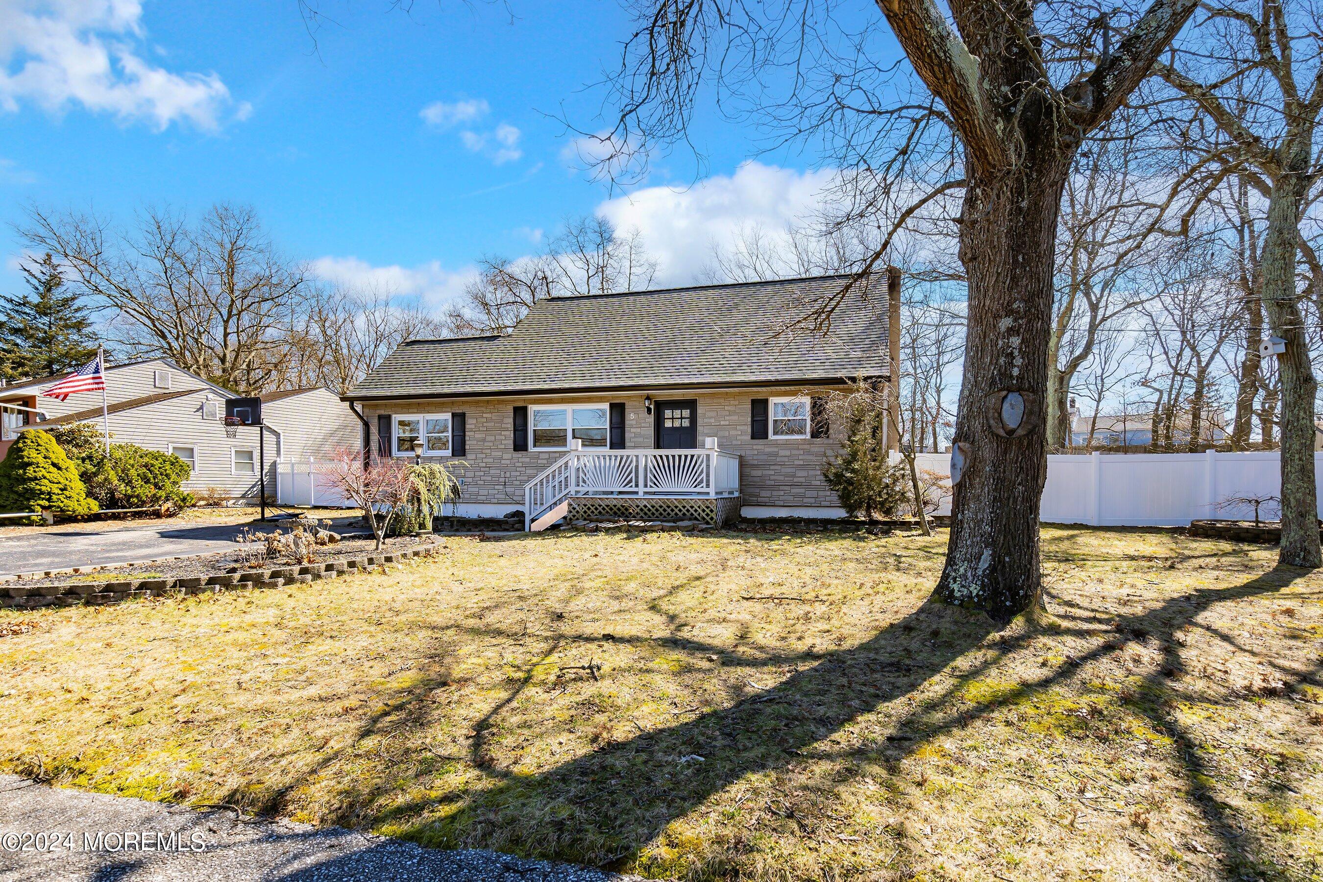 5 Hampton Road Howell, NJ 07731 - Photo 3 of 27 a view of a house with snow on the tree