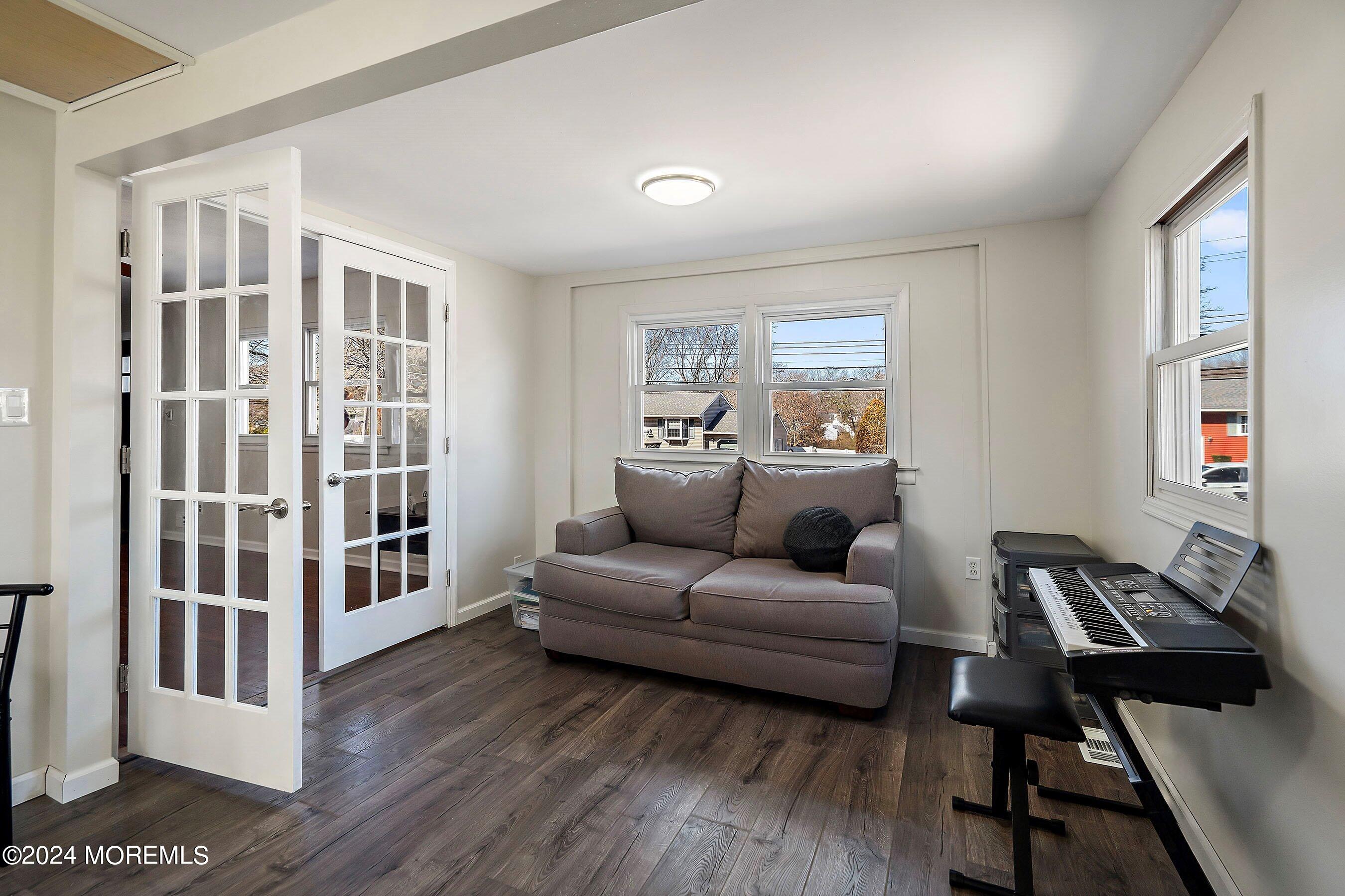 5 Hampton Road Howell, NJ 07731 - Photo 7 of 27 a living room with furniture and a book shelf