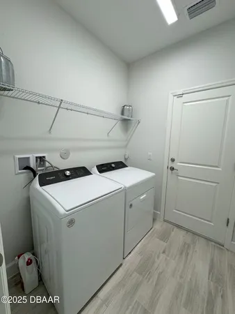 a utility room with dryer and washer
