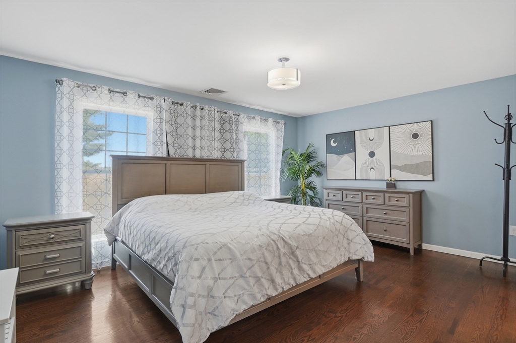 112 Pineland Avenue Worcester, MA 01604 - Photo 13 of 38 a bedroom with a bed and a dresser