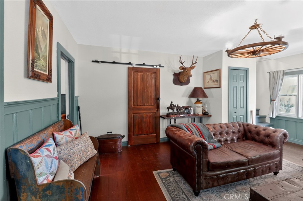 2775 View Running Springs, CA 92382 - Photo 12 of 30 a living room with furniture and a chandelier