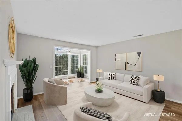 a living room with furniture and white walls