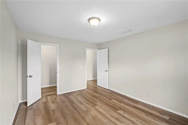 a living room with furniture and a laptop